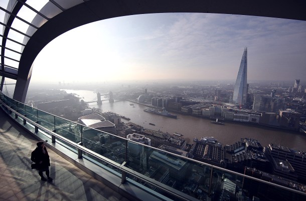 LONDON, ENGLAND - MARCH 12: A visitor looks at the view from the Sky Garden terrace at 20 Fenchurch Street on March 12, 2015 in London, England. Number 20 Fenchurch Street is London's newest skyscraper, known locally as The Walkie Talkie. The Sky Garden sits at the top of the 160 metre, 500 million GBP building and is now open to the public. (Photo by Peter Macdiarmid/Getty Images) ***BESTPIX***